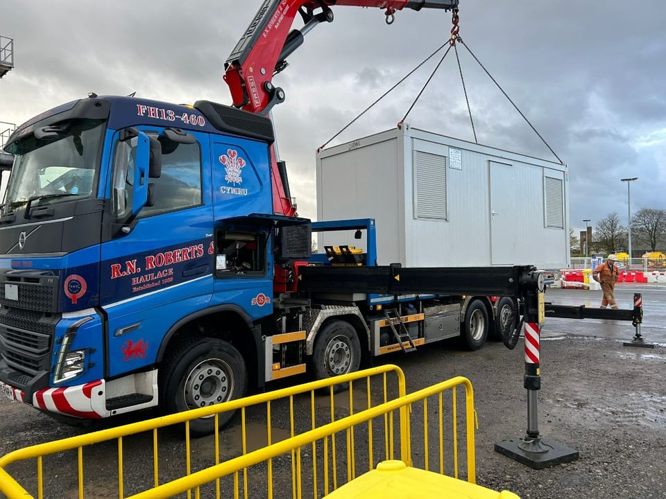 RN Roberts HIAB crane placing a modular building unit on site