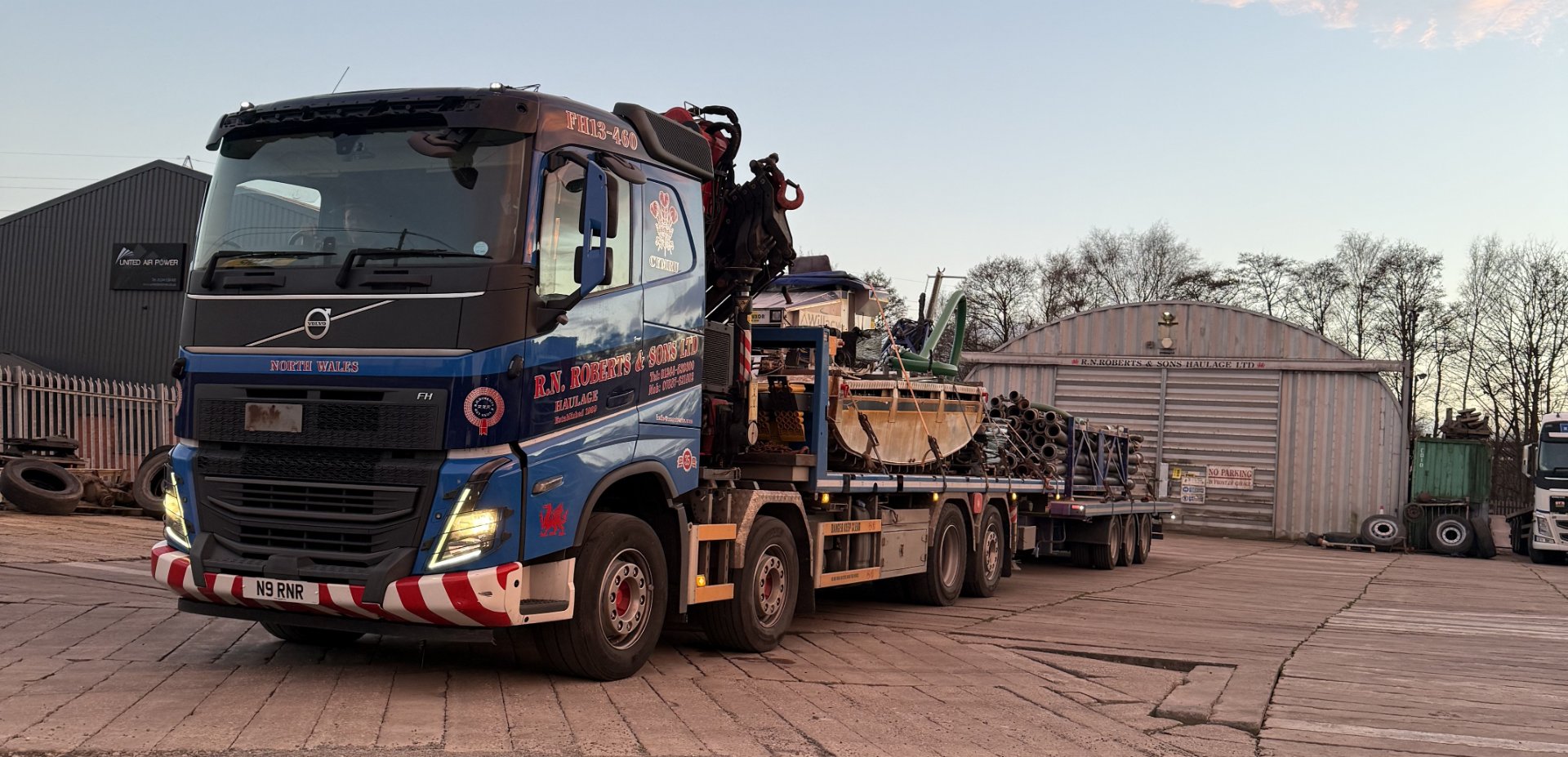 RN Roberts Volvo rigid HIAB coupled to a loaded drawbar trailer at the depot