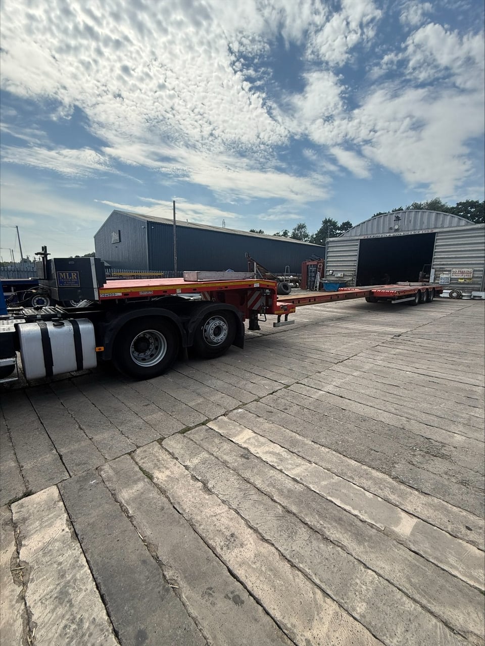 RN Roberts step extender low loader trailer extended, coupled to a Volvo tractor unit at the depot
