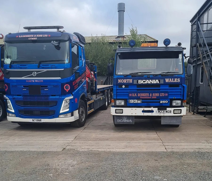 RN Roberts modern Volvo beside a vintage Scania